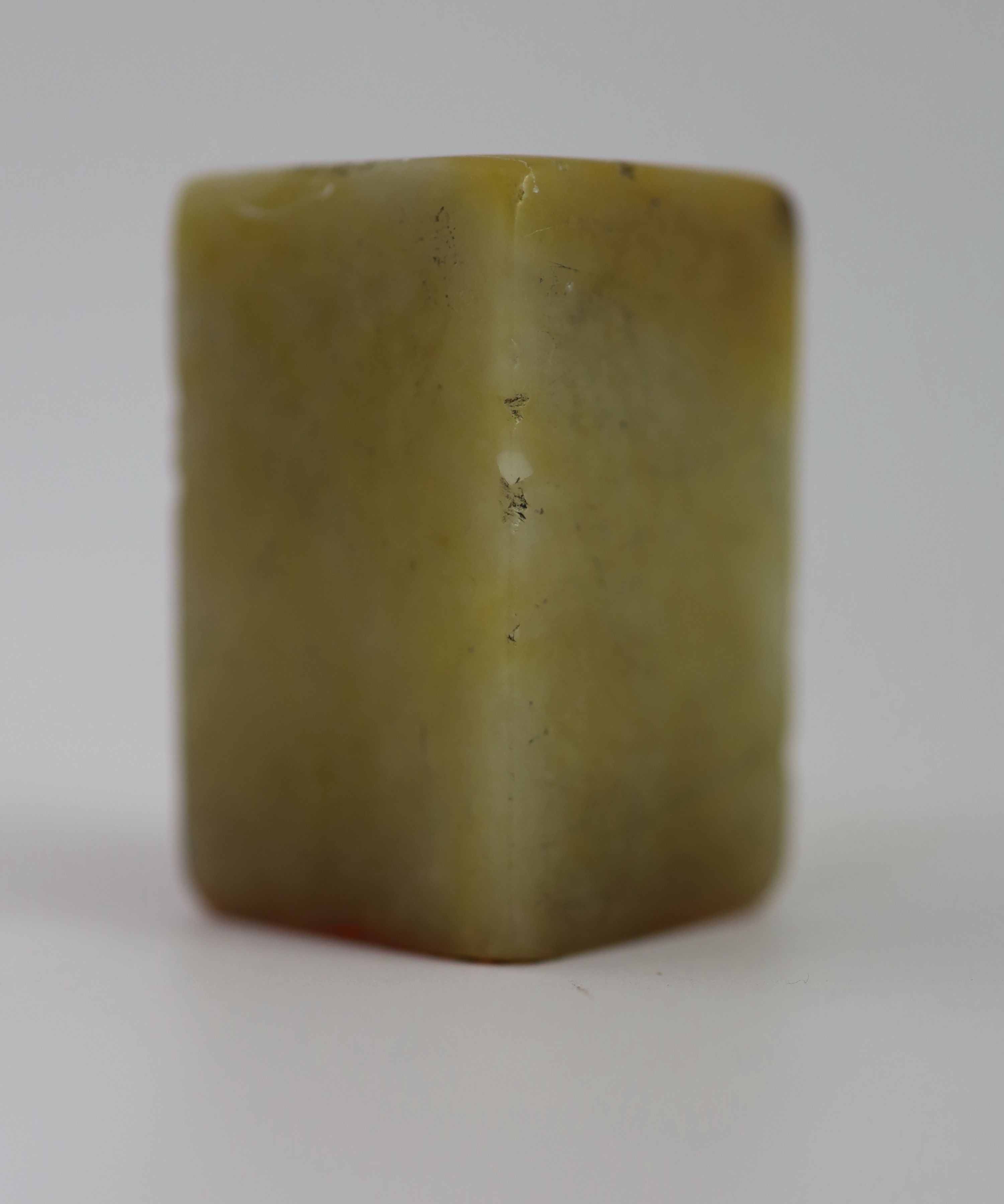 A Chinese cream and russet soapstone square seal, 5.2 cm high